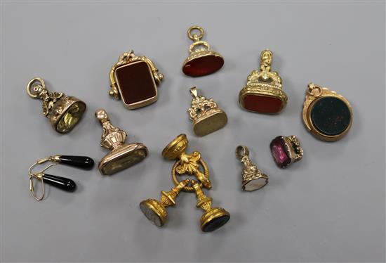 Ten assorted early 20th century and later fob seals, including 9ct and gem set, together with a pair of drop earrings.